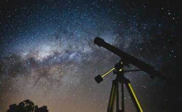 Photo of the night sky and a telescope