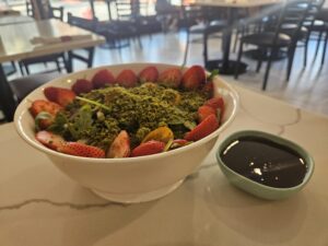 The rocca salad at Turkish Village with the pomegranate molasses on the side. Photo by Drew Saunders