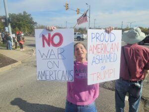 A protestor at the Ann Arbor No King's protest. Photograph by Drew Saunders.