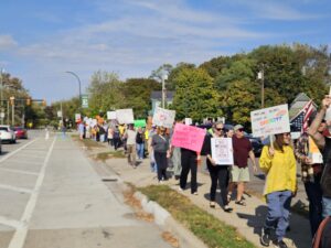No King's protestors marching along the eastern side of Ypsilanti's Huron Street on October 18. Photo by Drew Saunders.