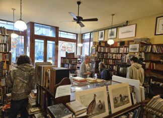 The front room of West Side Books peopled. Photo by Drew Saunders.