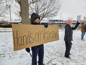 A protestor critical of the Trump Administration's attack on Venezuela in Ann Arbor, January 4. Photo by Drew Saunders.