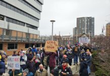 Hundreds March in Protest of Renee Nichole Good’s Death, from Diag to City Hall The crowd remembering Renee Nichole Good and protesting the Trump Administration's behavior to immigrants, racial minorities, and the rule of law, in front of Ann Arbor City Hall. Photo by Drew Saunders.